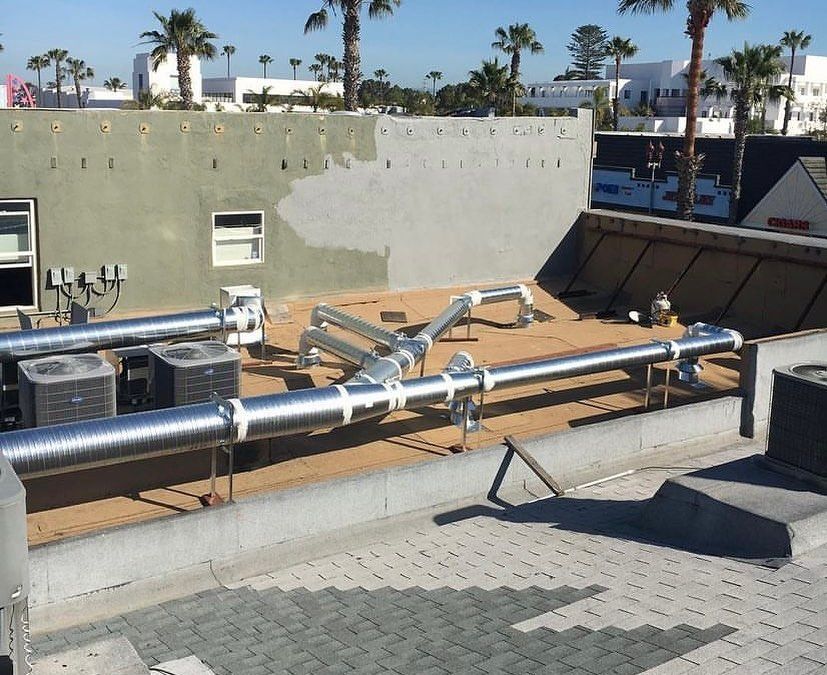 A roof with a lot of pipes on it