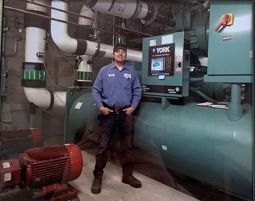A man standing in front of a york machine