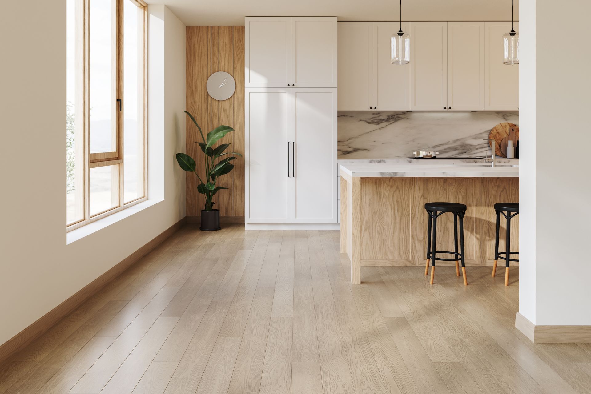 Bright minimalist kitchen and living area with light wood floors, white cabinets, and two stools at the island.