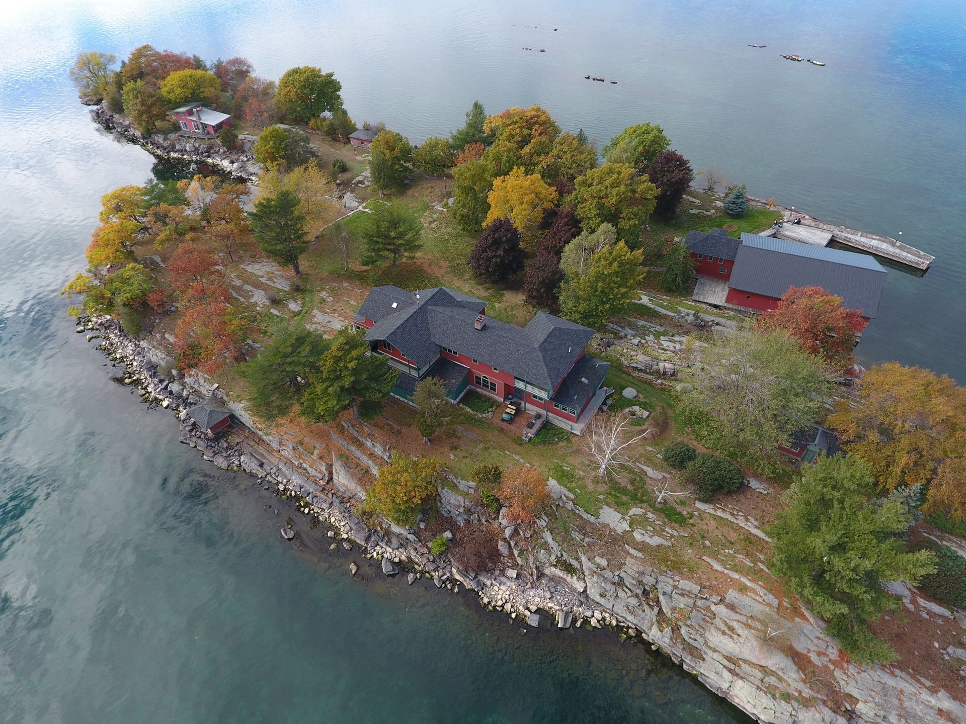 An aerial view of a small island in the middle of a body of water.