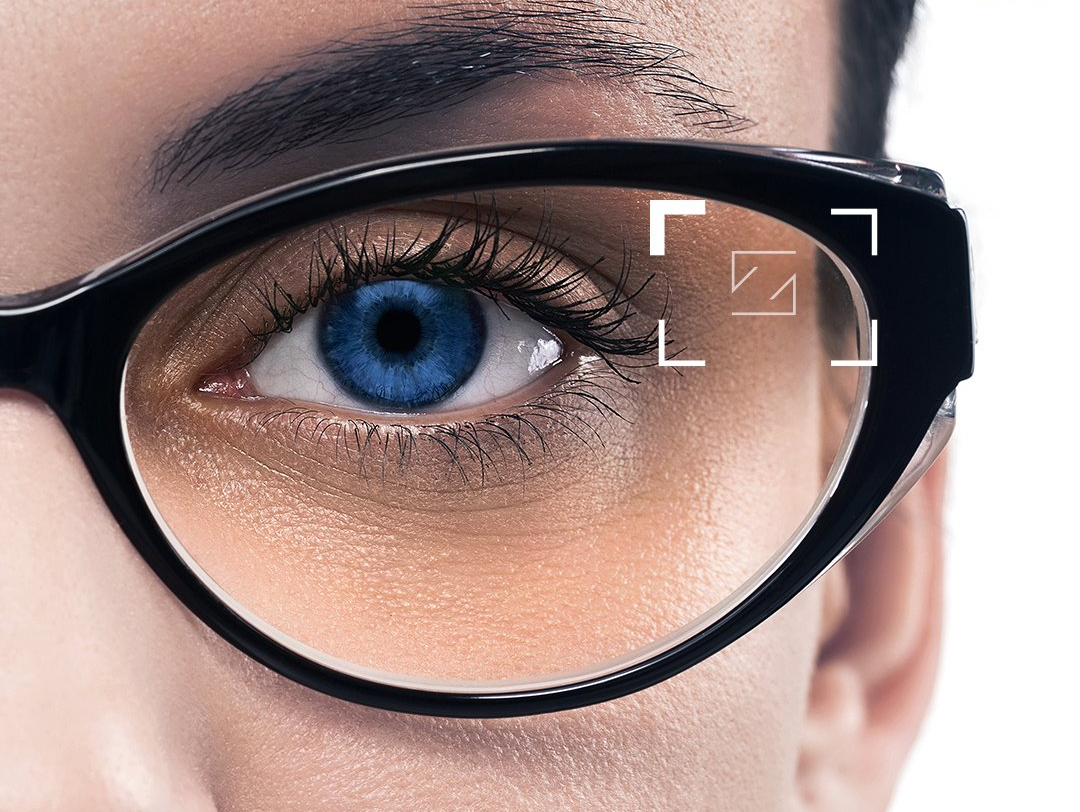 close up of persons eye wearing glasses