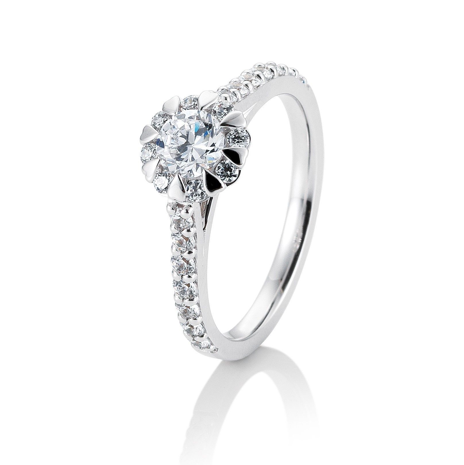Verlovingsring met diamant, een halo in de vorm van een bloem en een met diamanten bezette band.