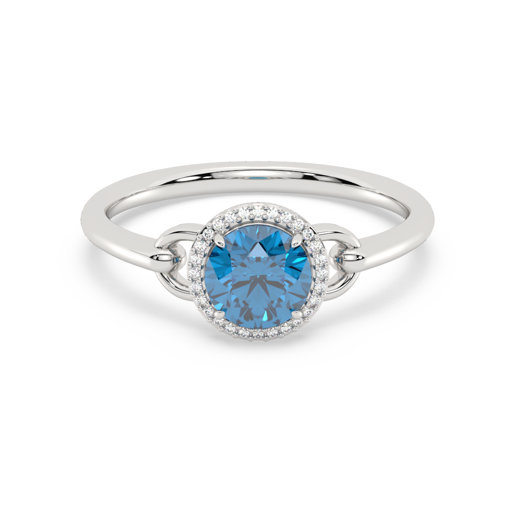 Zilveren ring met een blauwe edelsteen in het midden, omringd door kleine witte steentjes.