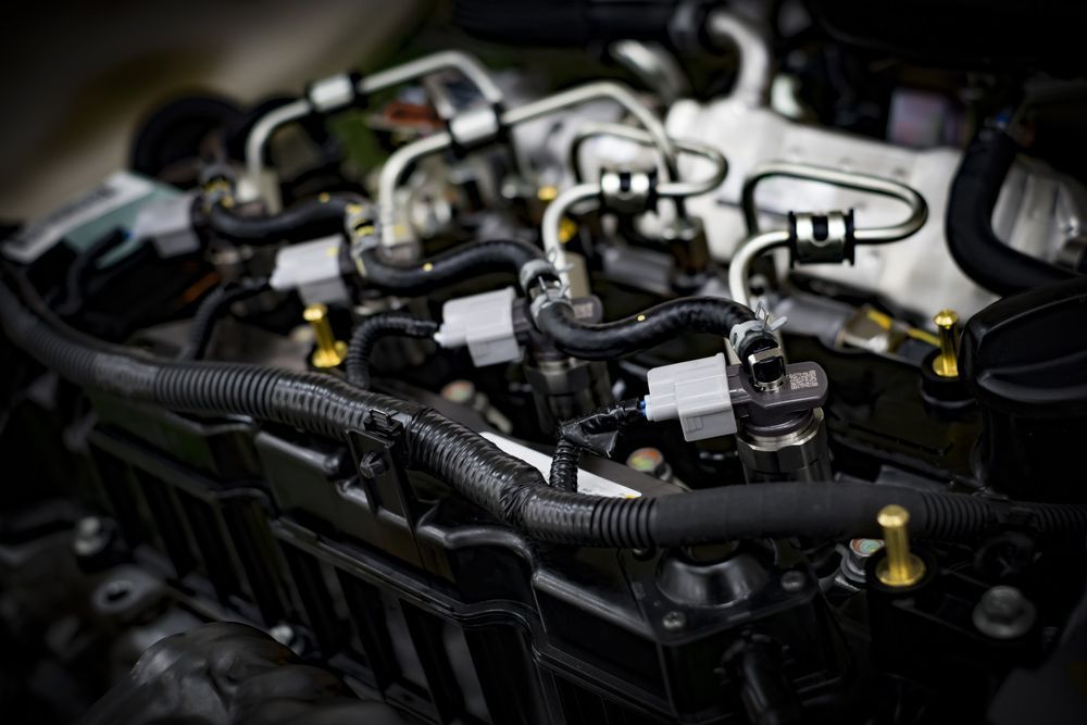 A Close Up Of the Inside of A Car Engine with Fuel Lines — Currajong Brake Parts Pty Ltd In Currajong, QLD
