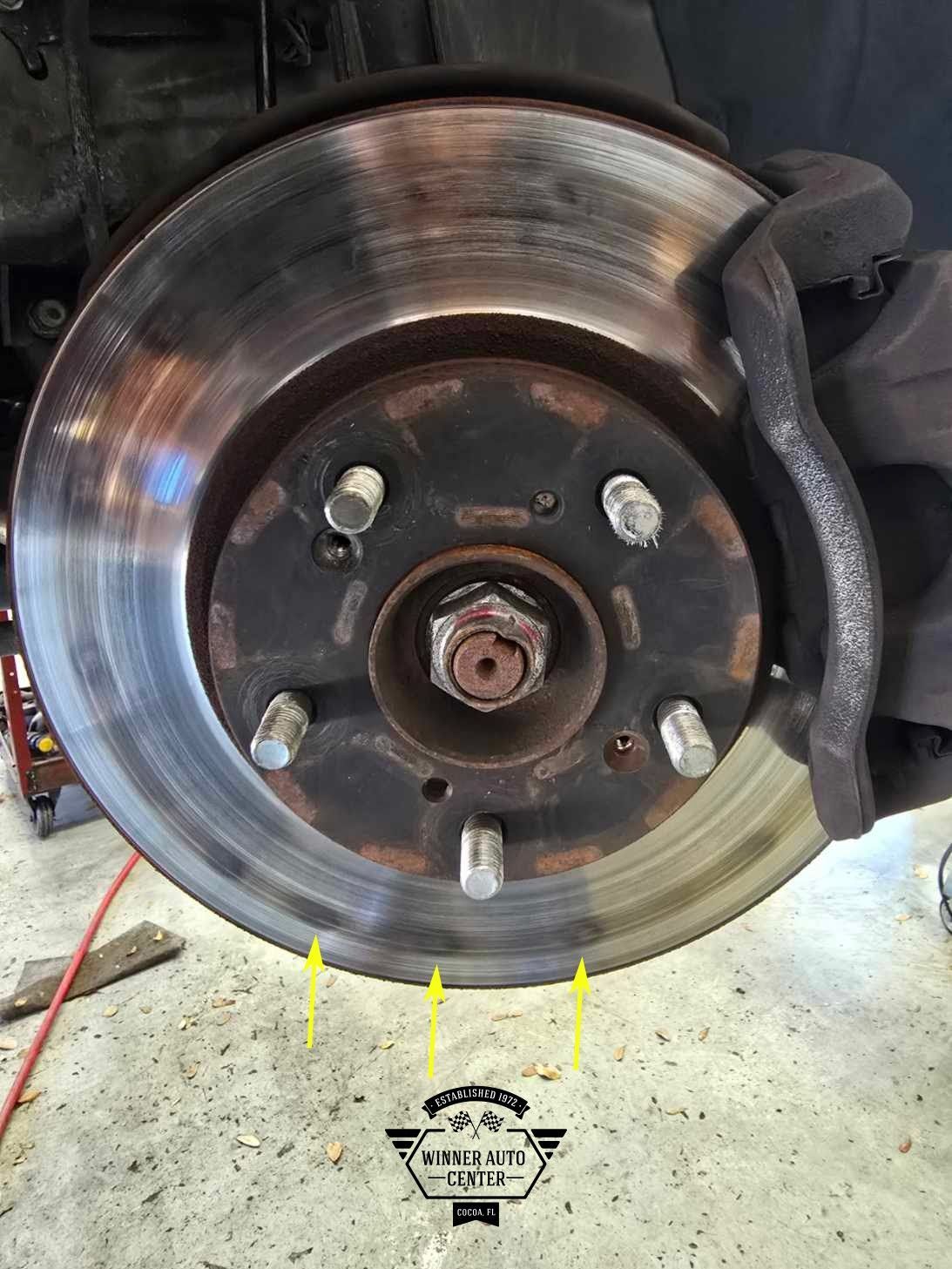 Car's brake rotor and caliper | Winner Auto Center
