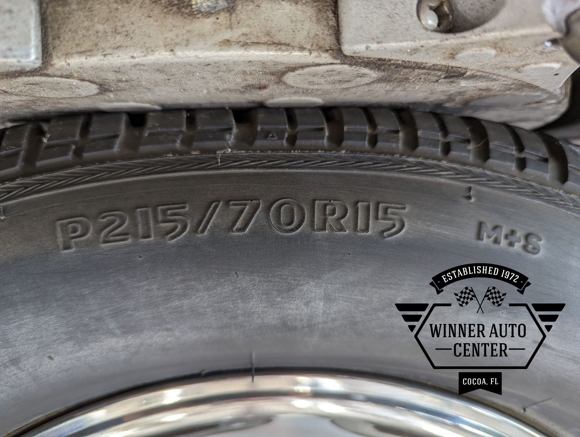 Close-up of a car tire displaying the size