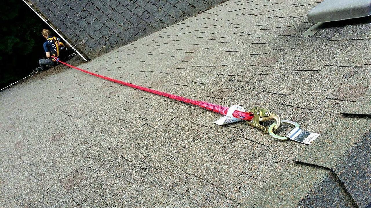 Roof anchor safety hardware installed on a residential roof
