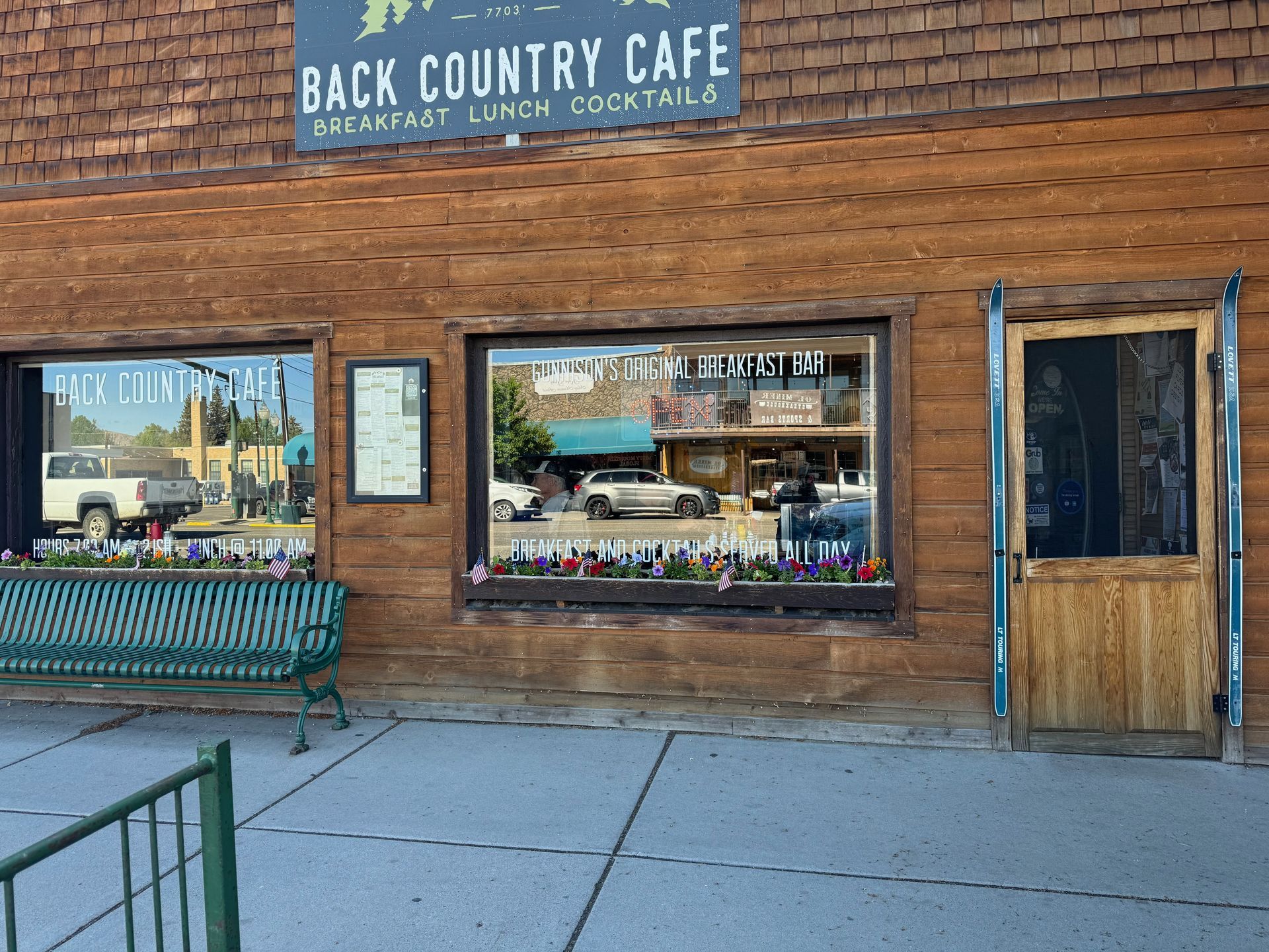 A wooden building with a sign that says back country cafe