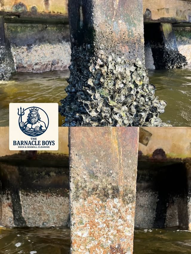 Worker pressure-washing barnacle-covered dock pilings beside turquoise water and white waterfront homes