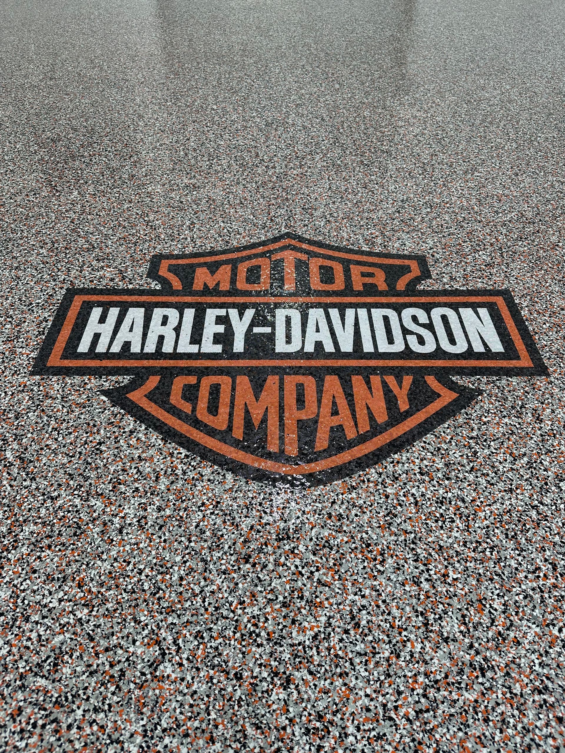 Harley-Davidson logo on a speckled gray surface