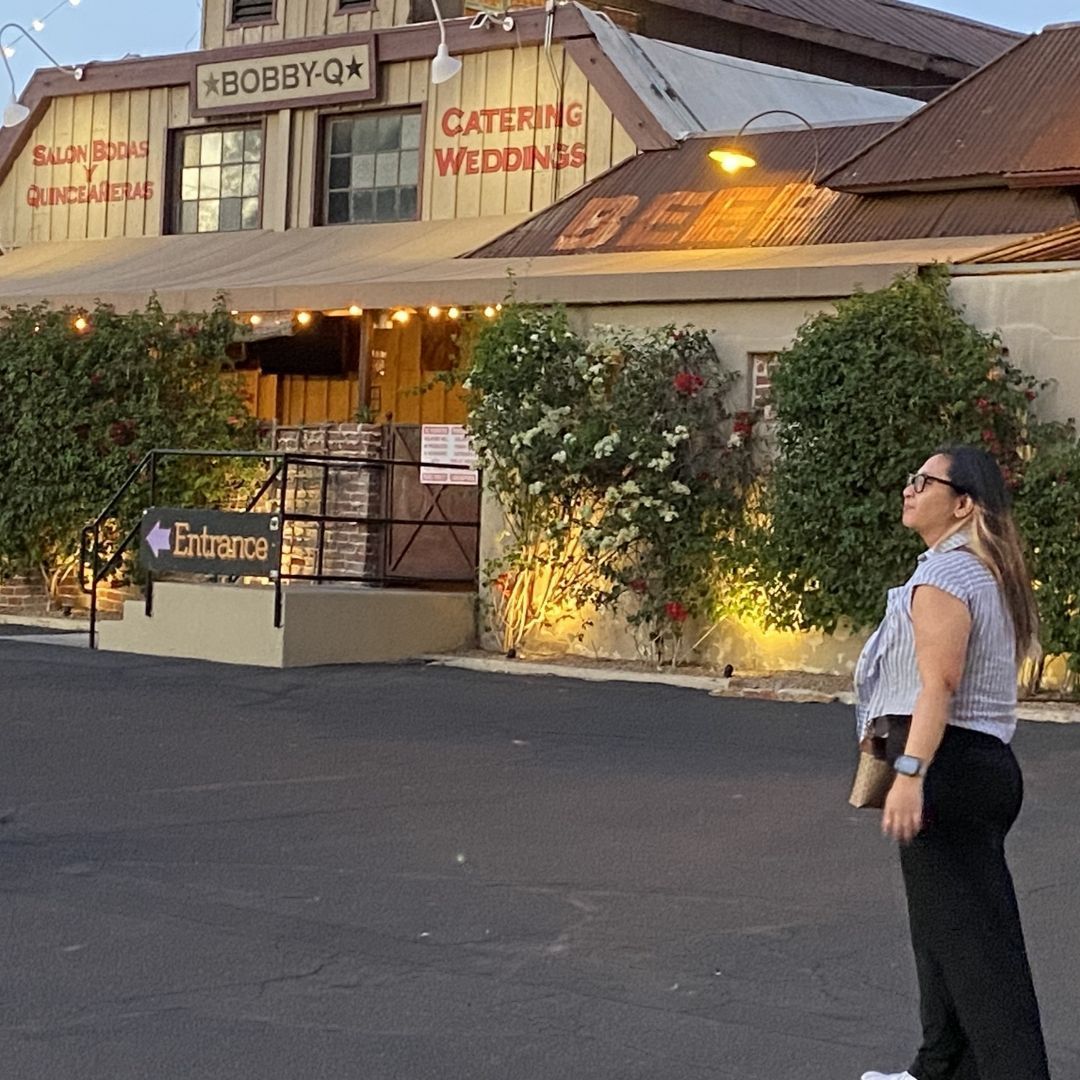 Deanne of Done by Di digital marketing agency standing outside a Phoenix Arizona small business venu
