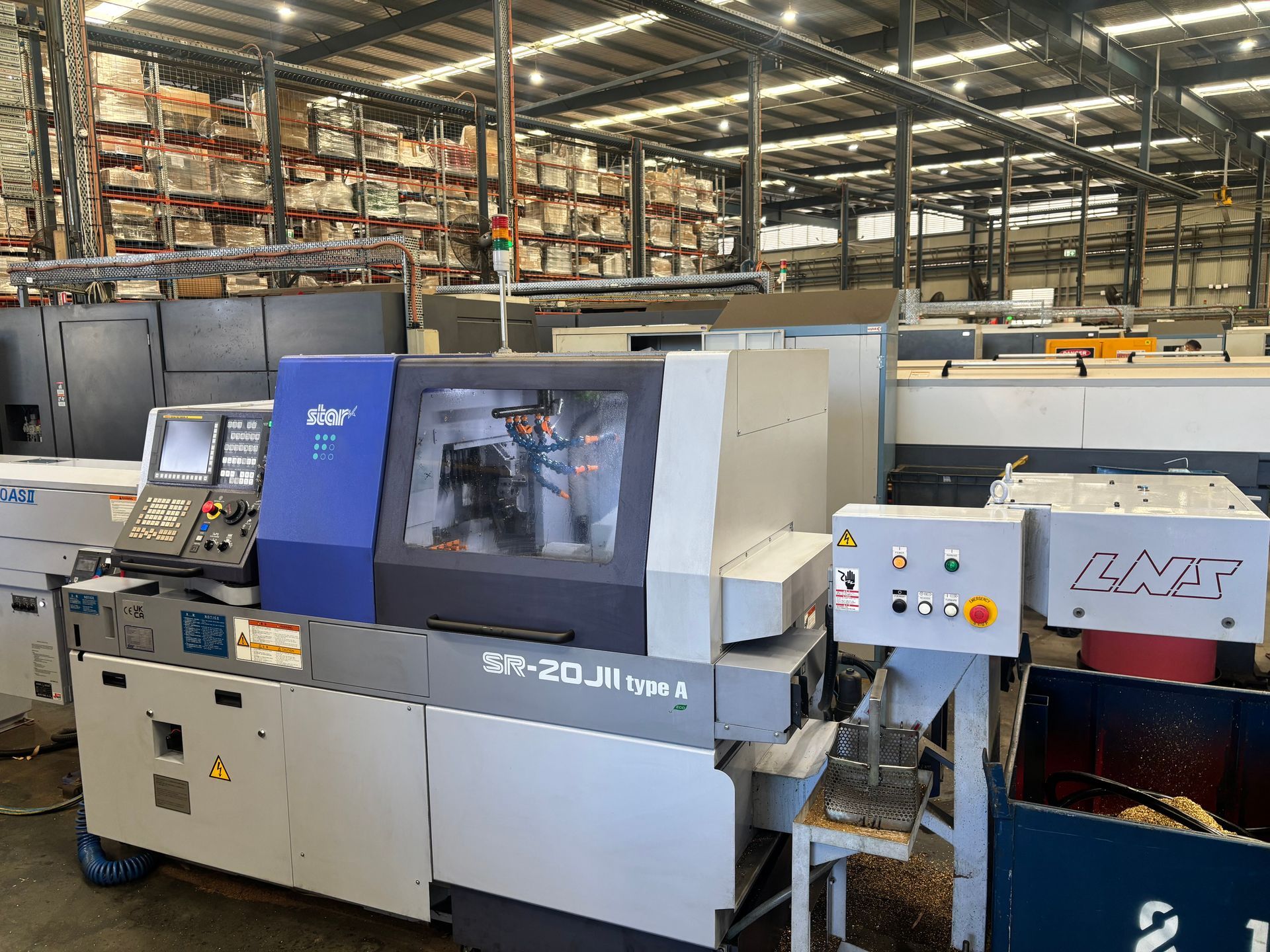 A large machine is sitting in a factory.