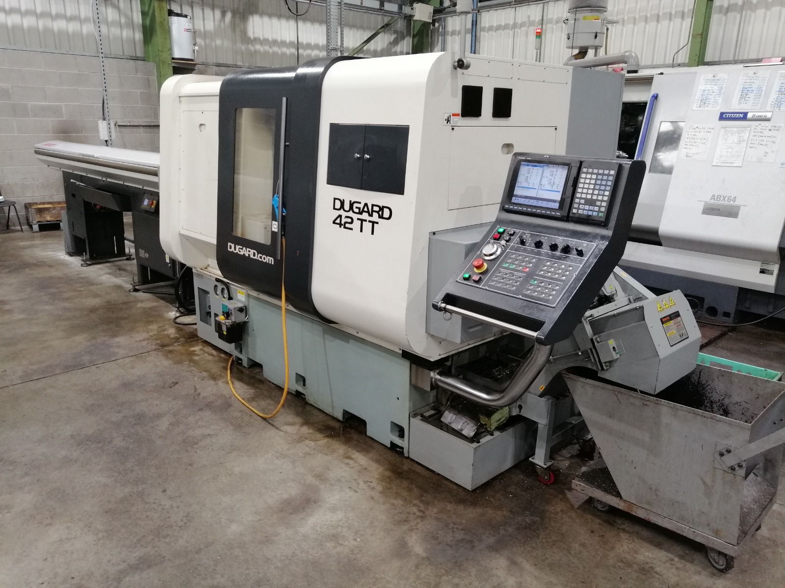 A machine is sitting on a table in a factory.
