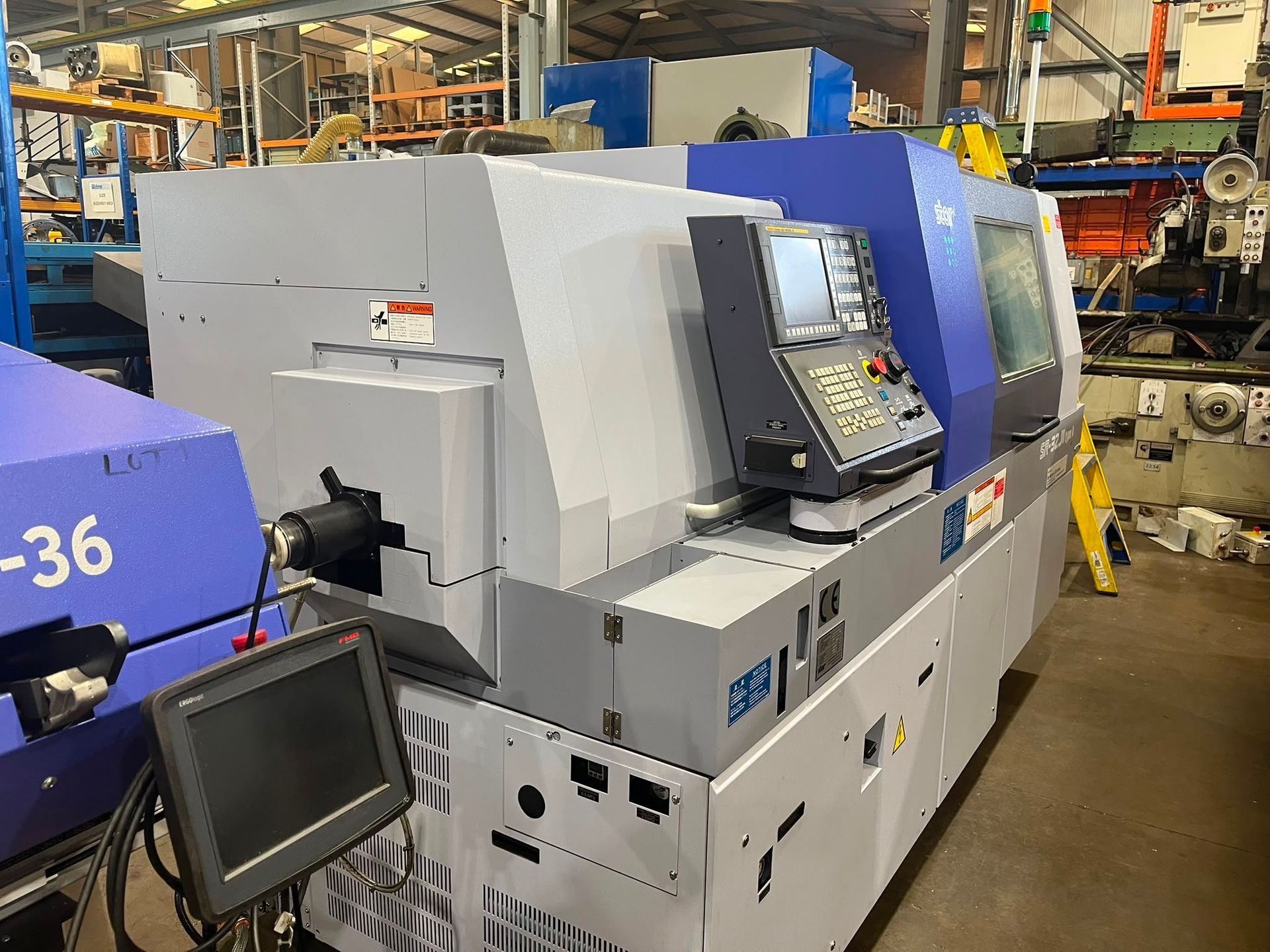 A machine is sitting on a table in a factory.