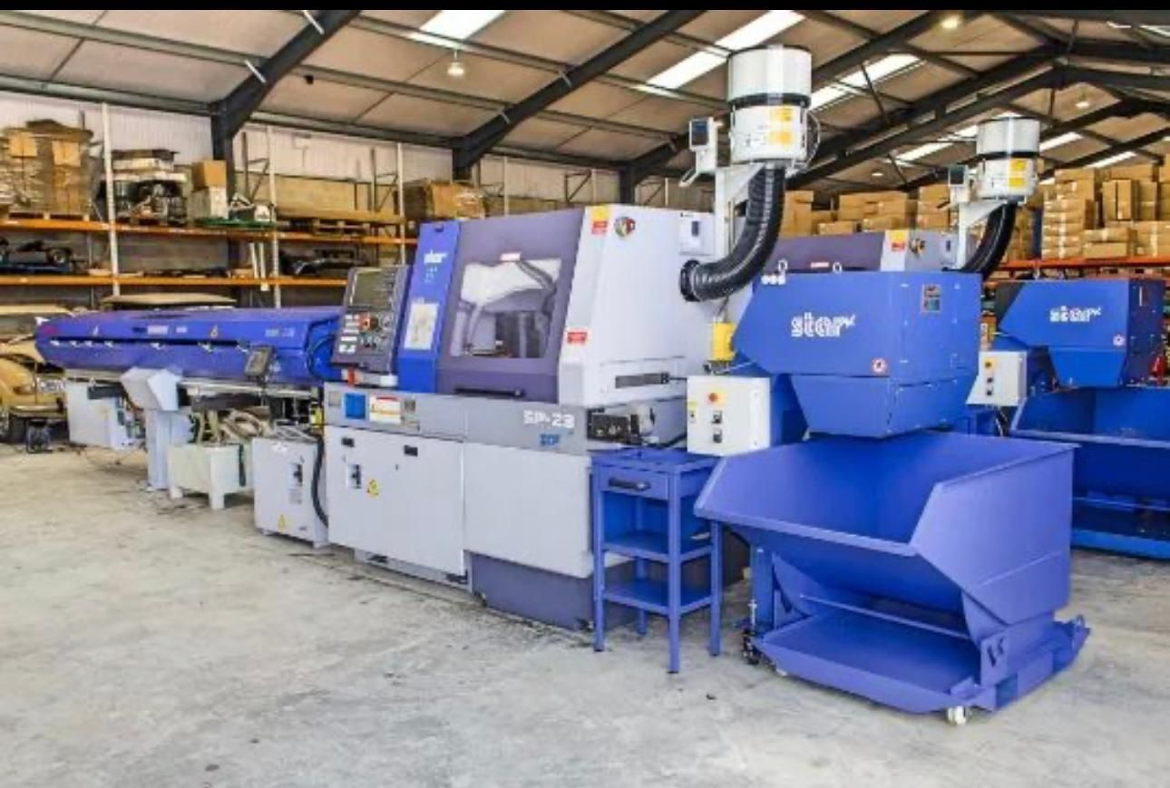 A machine with a sign on it that says machining intelligently.