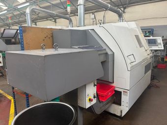 A machine is sitting on a table in a factory.