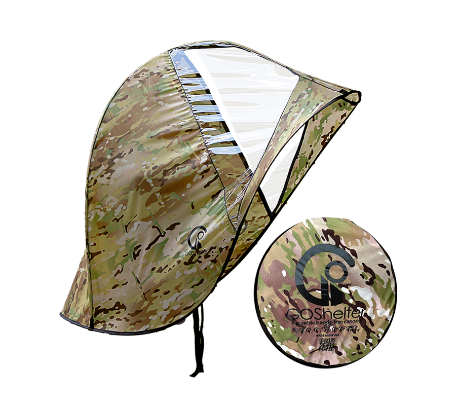 MultiCam® camouflage GOShelter Wearable Hands-Free Canopy for rain protection and sunshade with clear windows open and folded next to a disc with the brand logo.