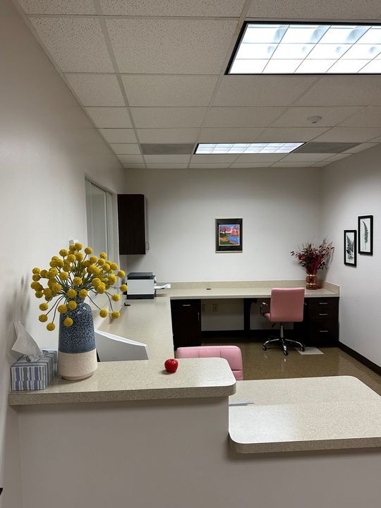 Smiling Woman Using Laptop — Riverdale, GA — Tara Gynecology