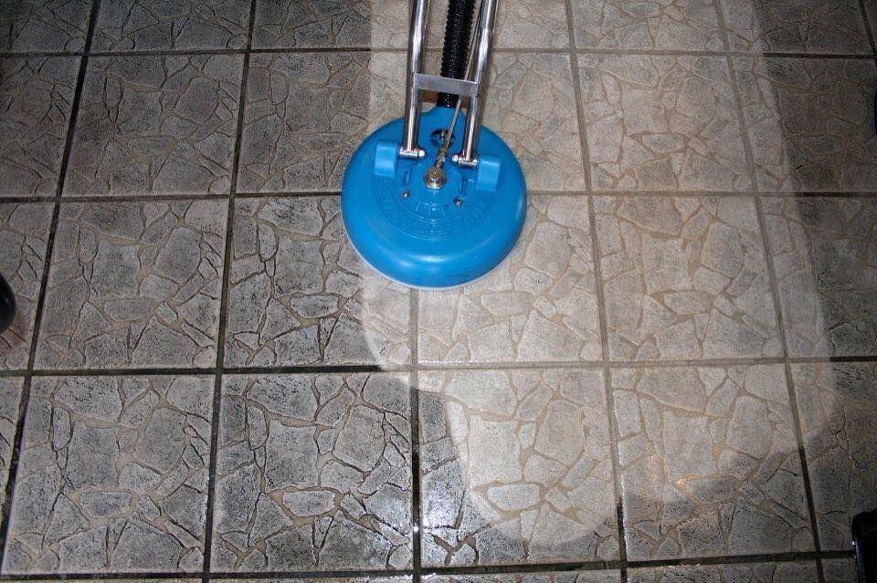 Blue Cleaning Machine on Tiled Floor, Cleaning Visible Area — Ultimate Restoration Services in Koongal, QLD