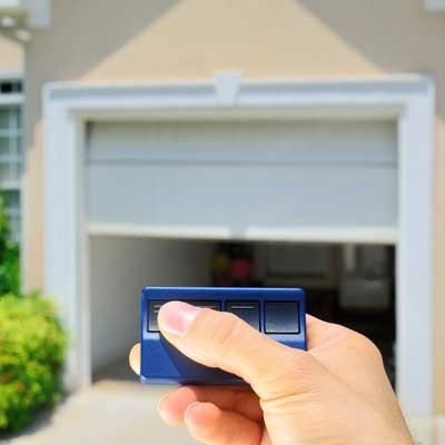 Person using an automatic garage door opener Person using an automatic garage door opener