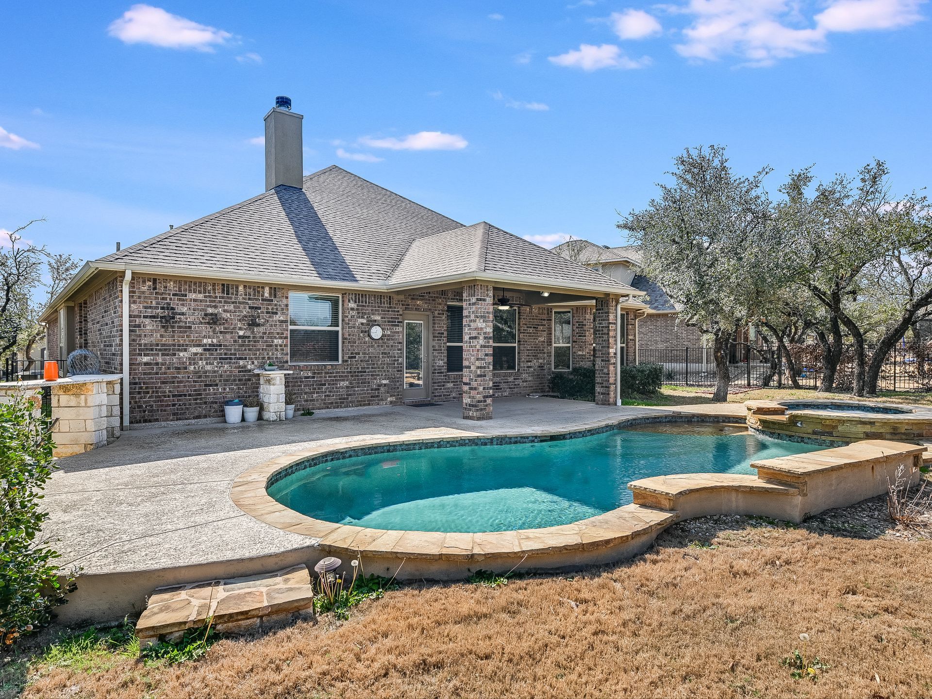 Beautiful home exterior with large pool