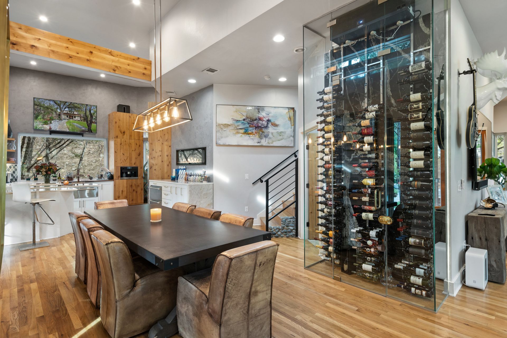 sophisticated luxury living room with large wine celler