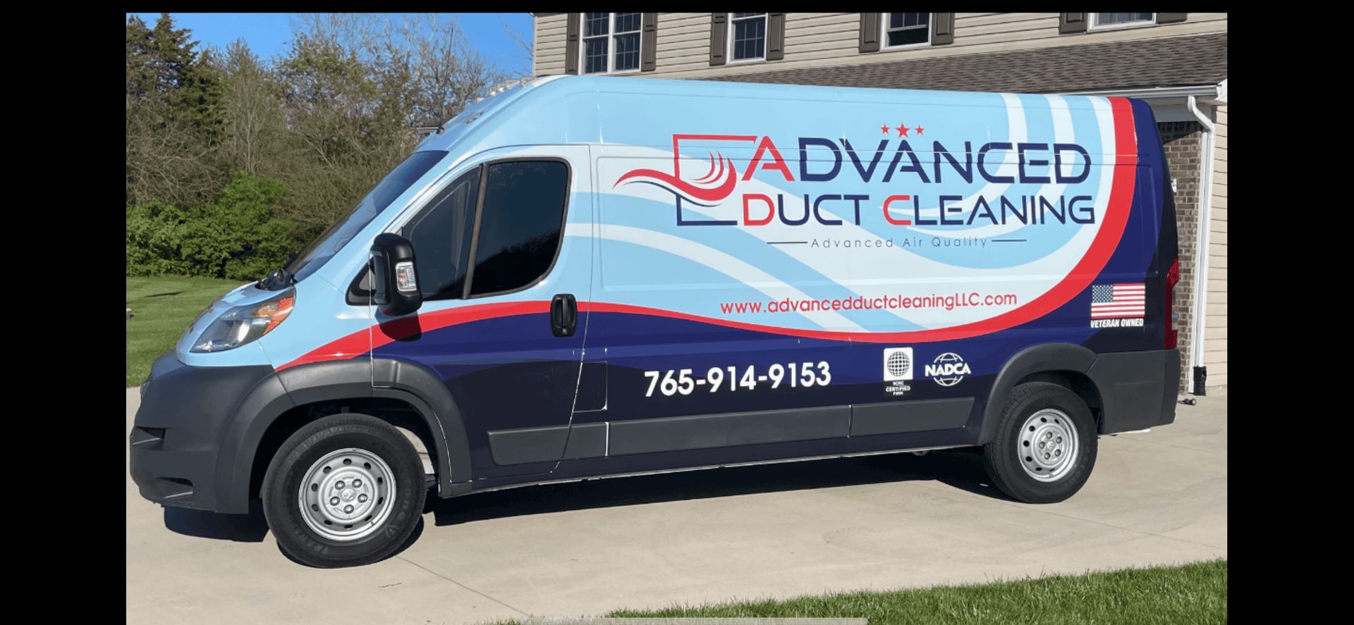 Blue Advanced Duct Cleaning van parked outdoors with company logo and phone number on the side