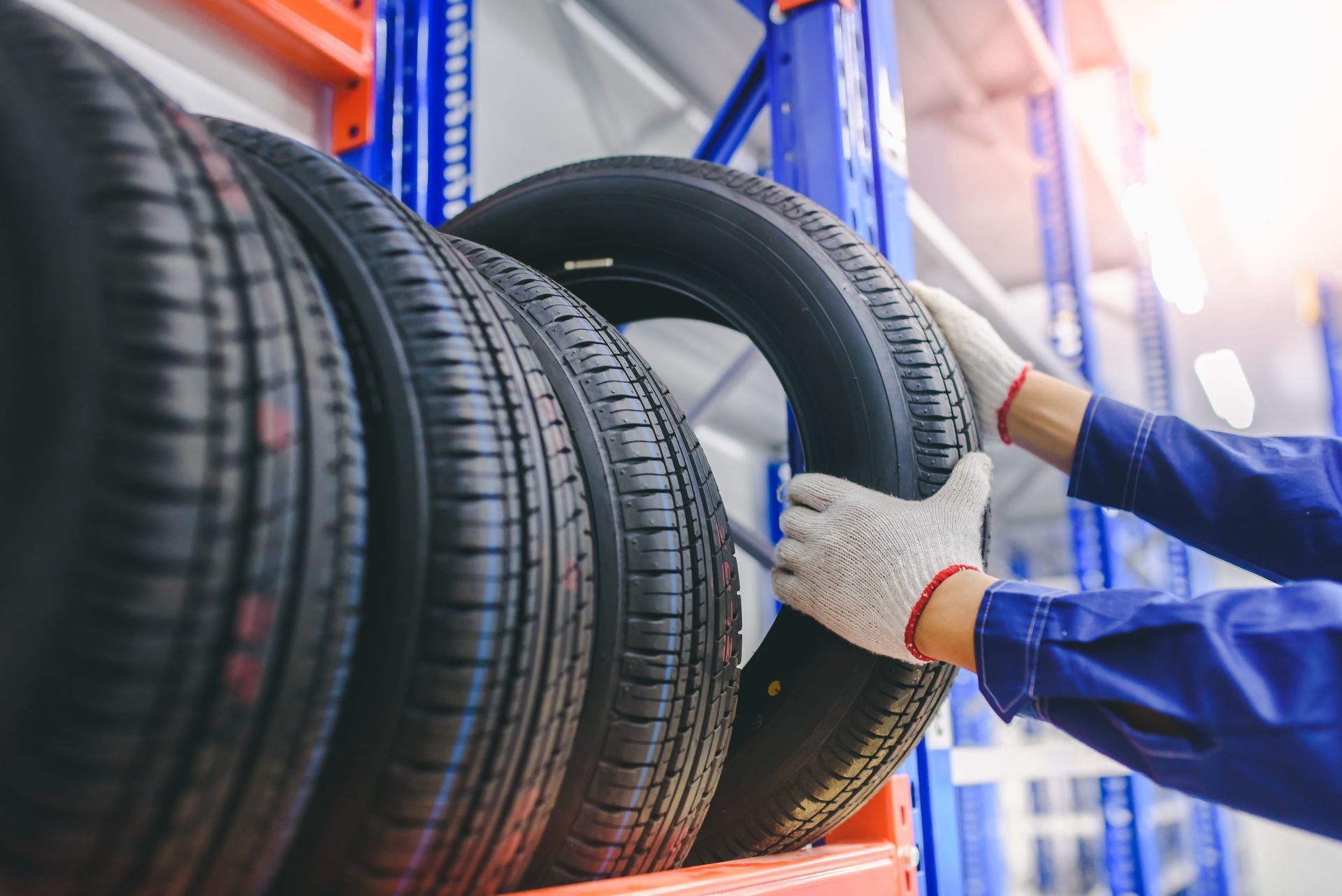 male tire changer In the process of checking the condition of new tires.
