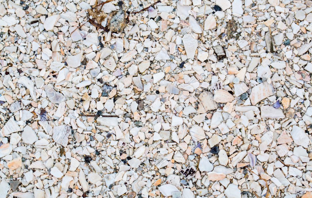 Close-up of white and beige crushed gravel stones