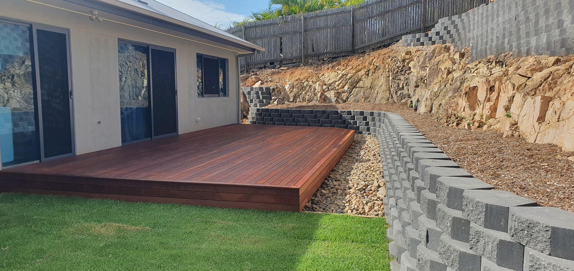 Garden With Stone And Lawn — Austen Landscaping & Earthmoving in Deeragun, QLD