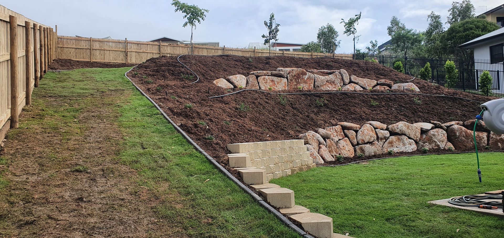 Retaining Wall Blocks With Excavator  — Austen Landscaping & Earthmoving in Deeragun, QLD