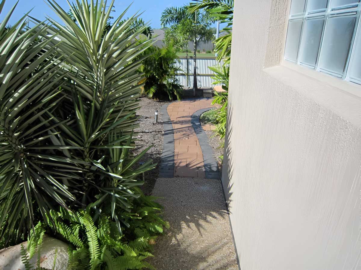 A Brick Walkway In The Garden — Austen Landscaping & Earthmoving in Castle Hill, QLD