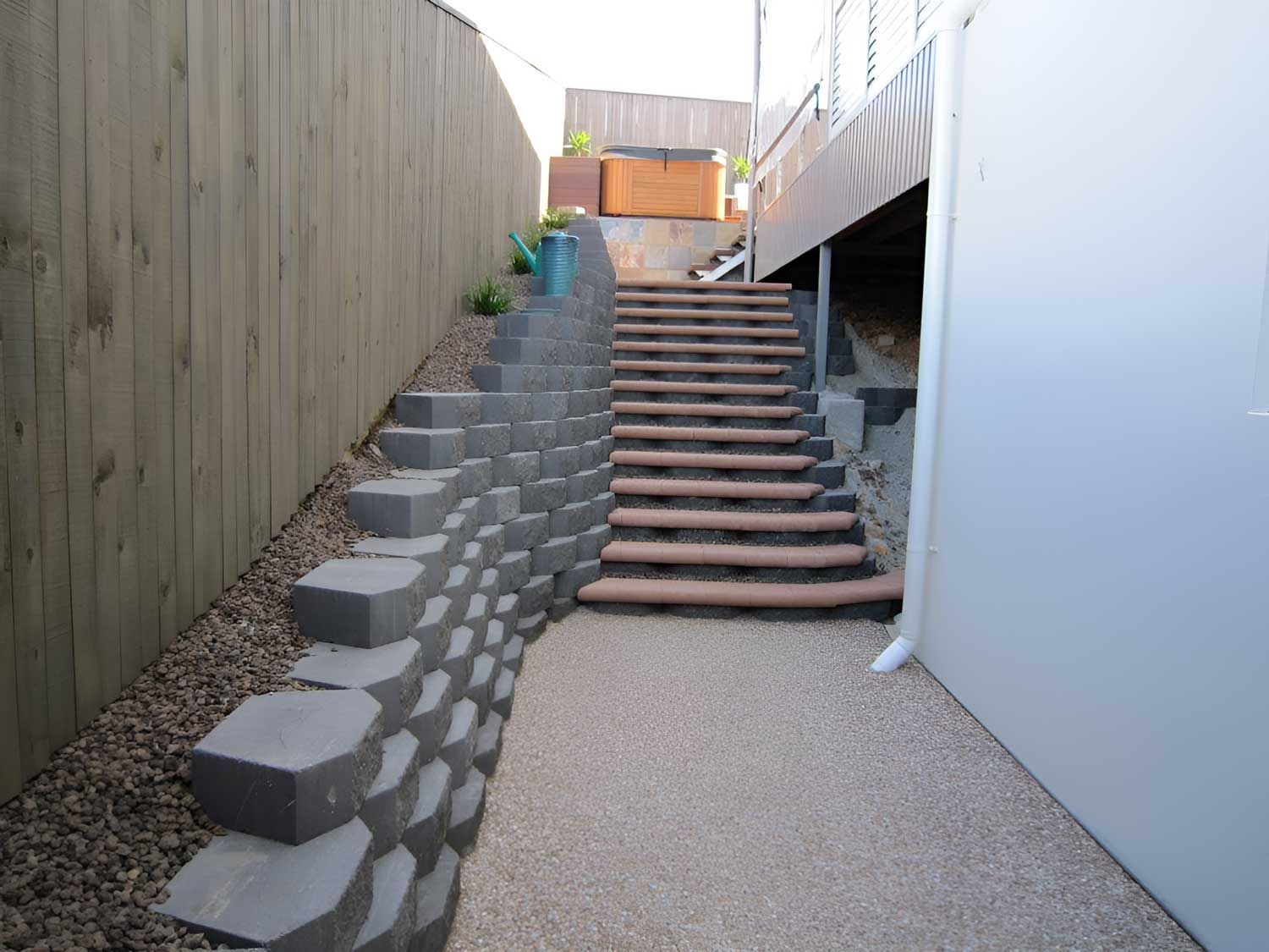 Back Of The House With Stairs And Retaining Wall — Austen Landscaping & Earthmoving in Deeragun, QLD