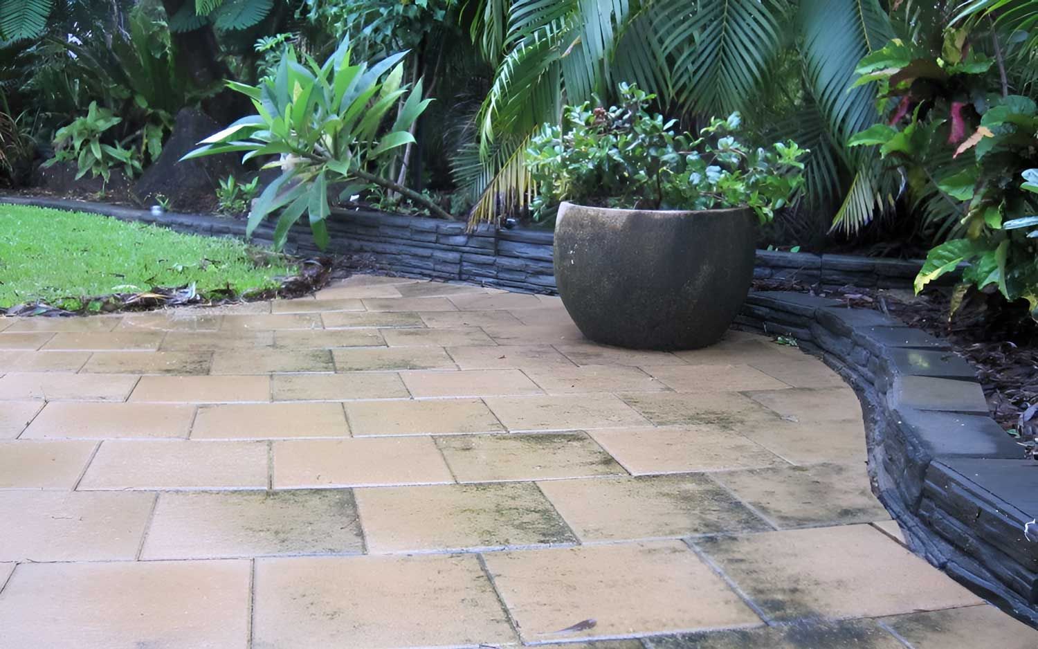 Potted Plant In The Middle Of It With Garden Retaining Wall — Austen Landscaping & Earthmoving in Deeragun, QLD