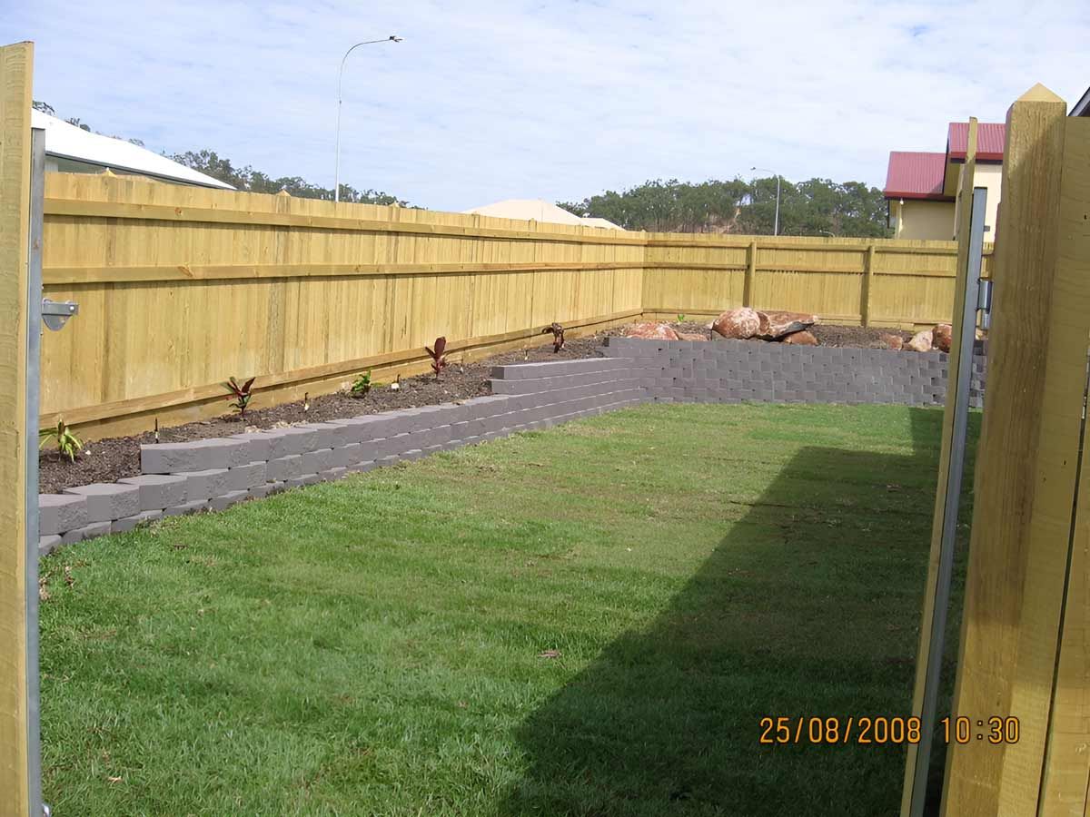 Large Landscaping Backyard With Retaining Wall Construction — Austen Landscaping & Earthmoving in Mount Isa, QLD