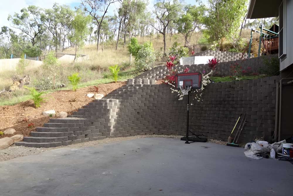 Backyard With Brickwall — Austen Landscaping & Earthmoving in Deeragun, QLD