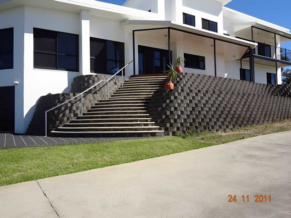 Garden with stone and lawn — Landscaper in Deeragun QLD