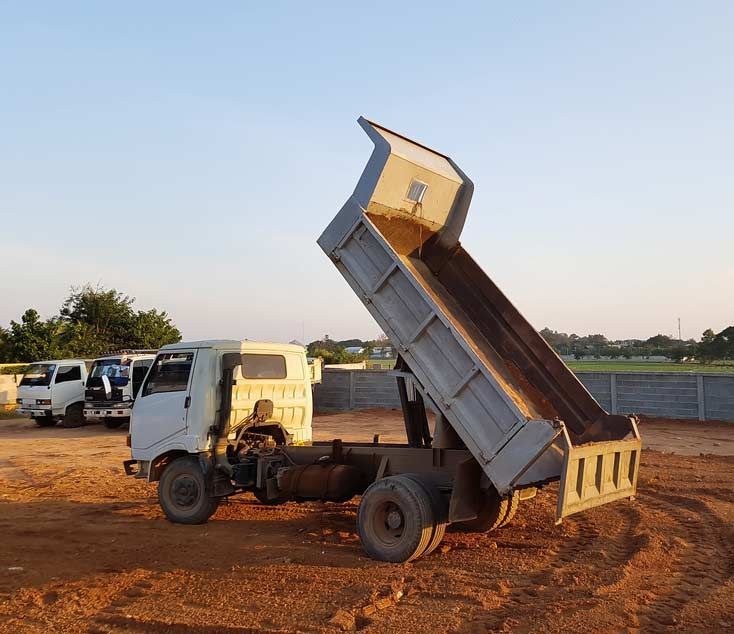 Unloading Soil At Construction Site — Austen Landscaping & Earthmoving in Deeragun, QLD