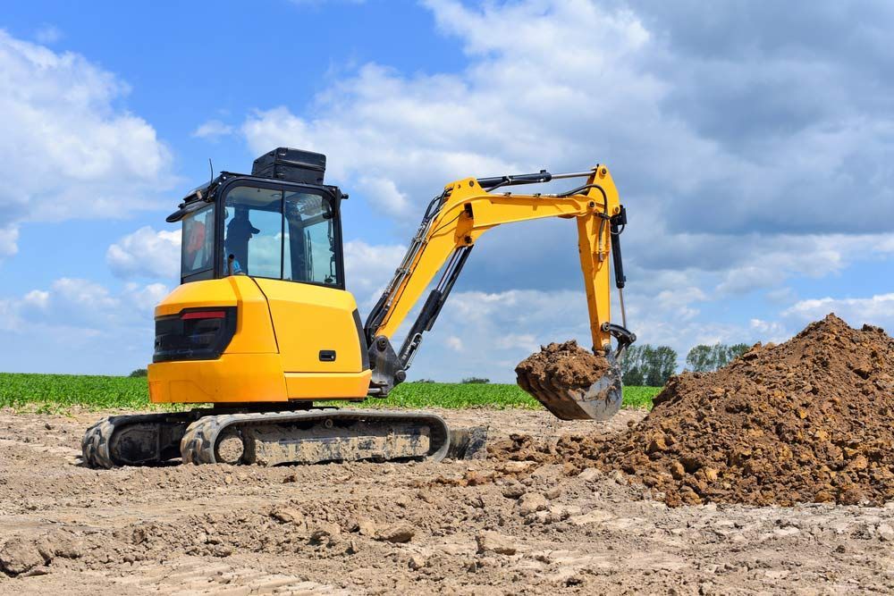 The Modern Excavator Performs Excavation Work On The Construction Site — Austen Landscaping & Earthmoving in Deeragun, QLD