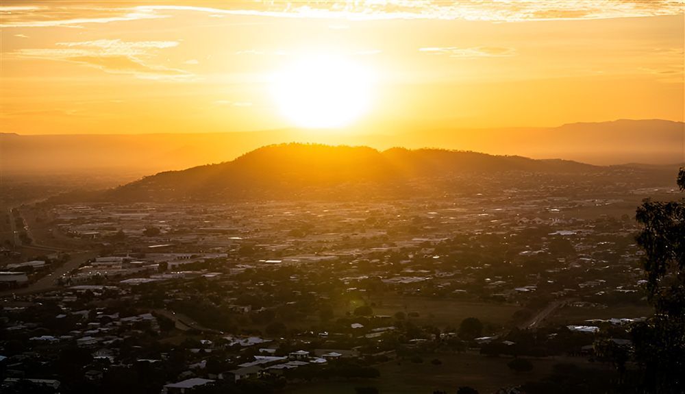 Sunset Over A City In Mount Louisa — Austen Landscaping & Earthmoving in Mount Louisa, QLD