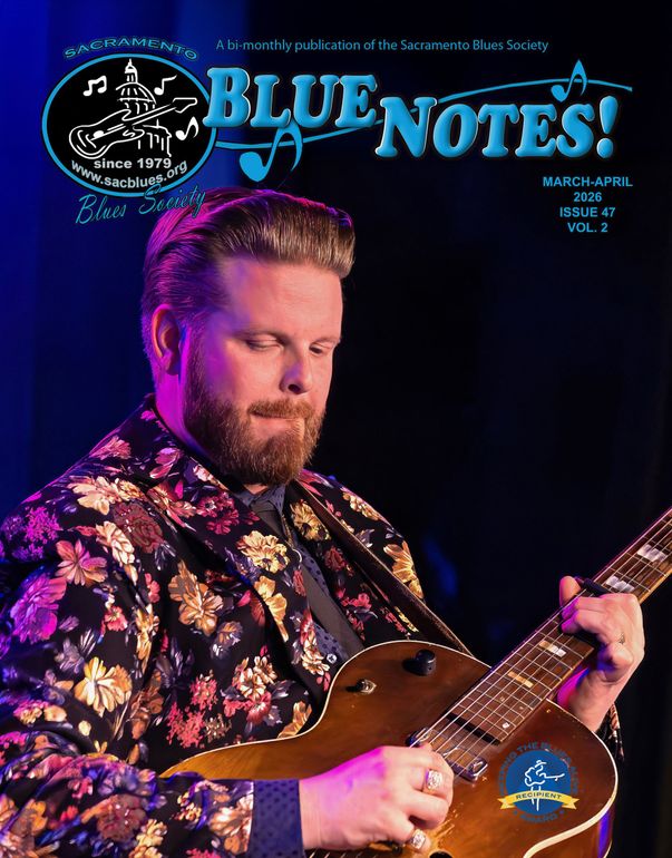 Musician playing guitar under purple stage lights, with Blue Notes! text above.