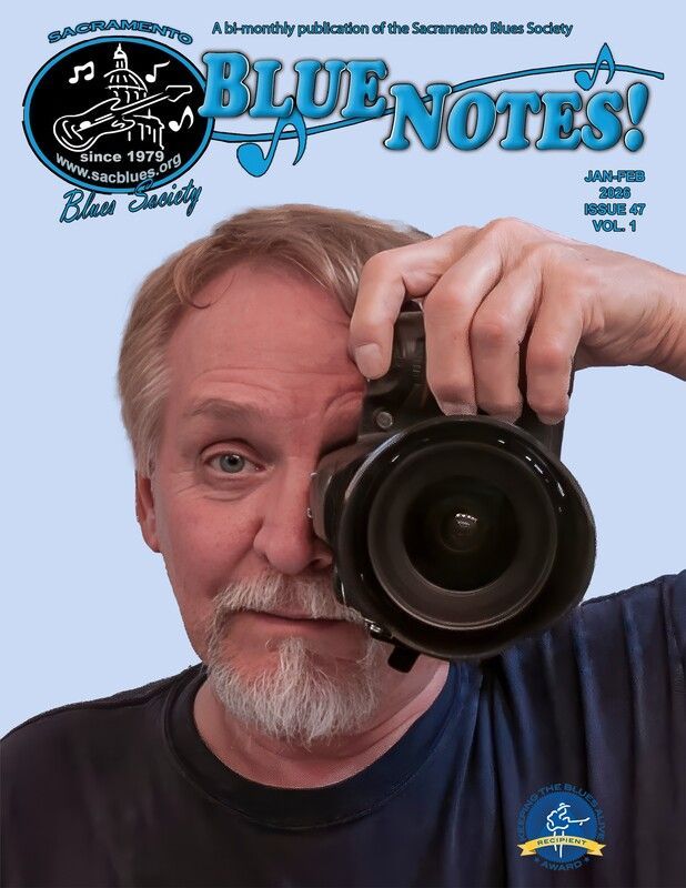 Man holding a camera close to his face on a Blue Notes magazine cover