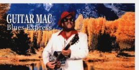 Album cover for “Guitar Mac Blues Express,” showing a man holding a guitar in a desert scene