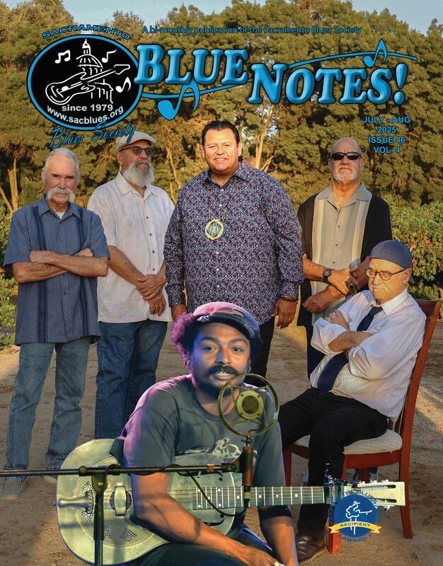 Blue Notes band promotional photo with six musicians posing outdoors in front of trees.