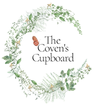 The coven 's cupboard logo is a wreath of flowers and leaves.