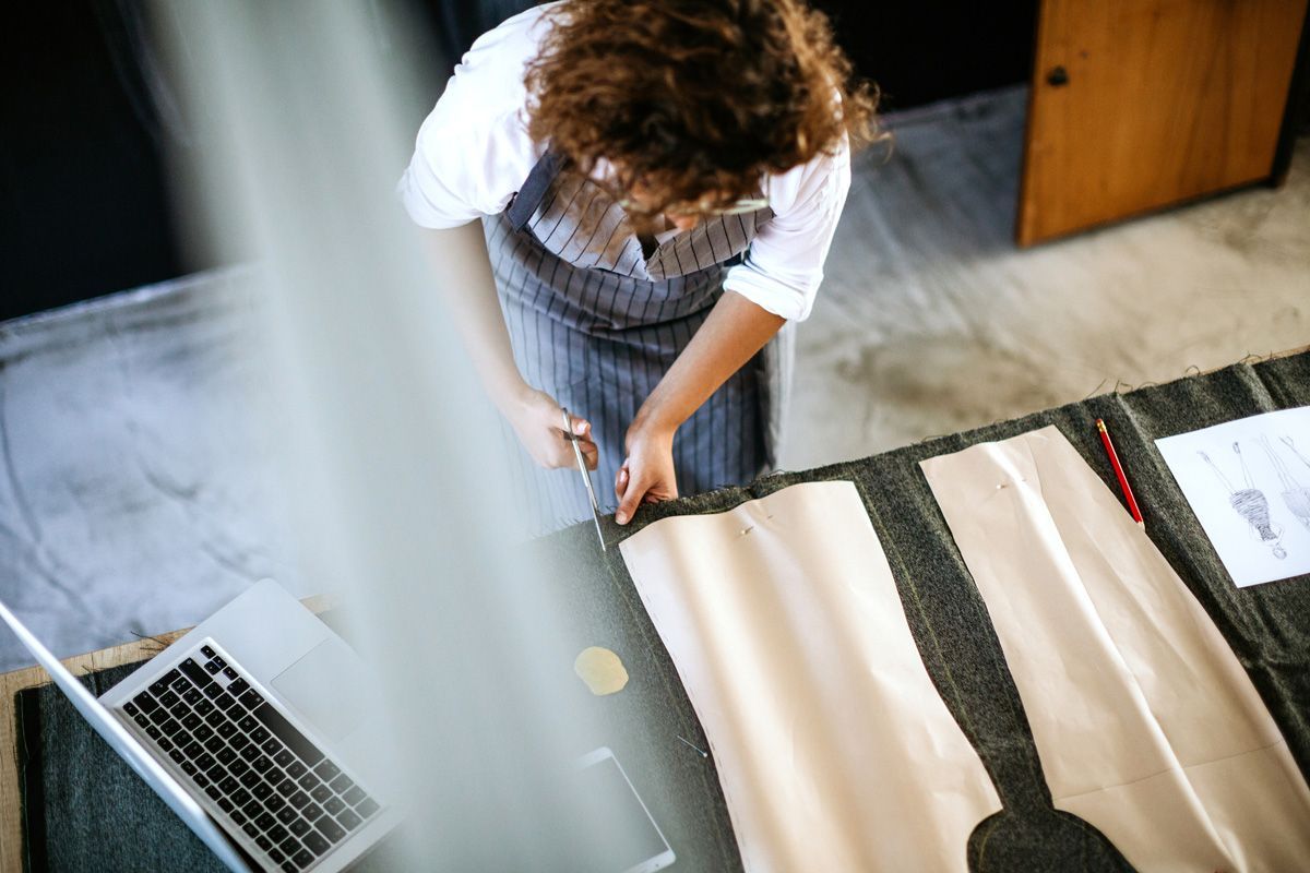 Creative Woman Making Clothes — Indianapolis, IN — Phoenix Design Concepts Creative Woman Making Clothes — Indianapolis, IN — Phoenix Design Concepts