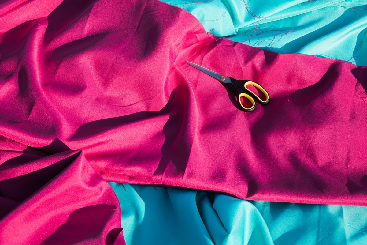 Scissors on the Bright Crimson Fabric — Indianapolis, IN — Phoenix Design Concepts Scissors on the Bright Crimson Fabric — Indianapolis, IN — Phoenix Design Concepts