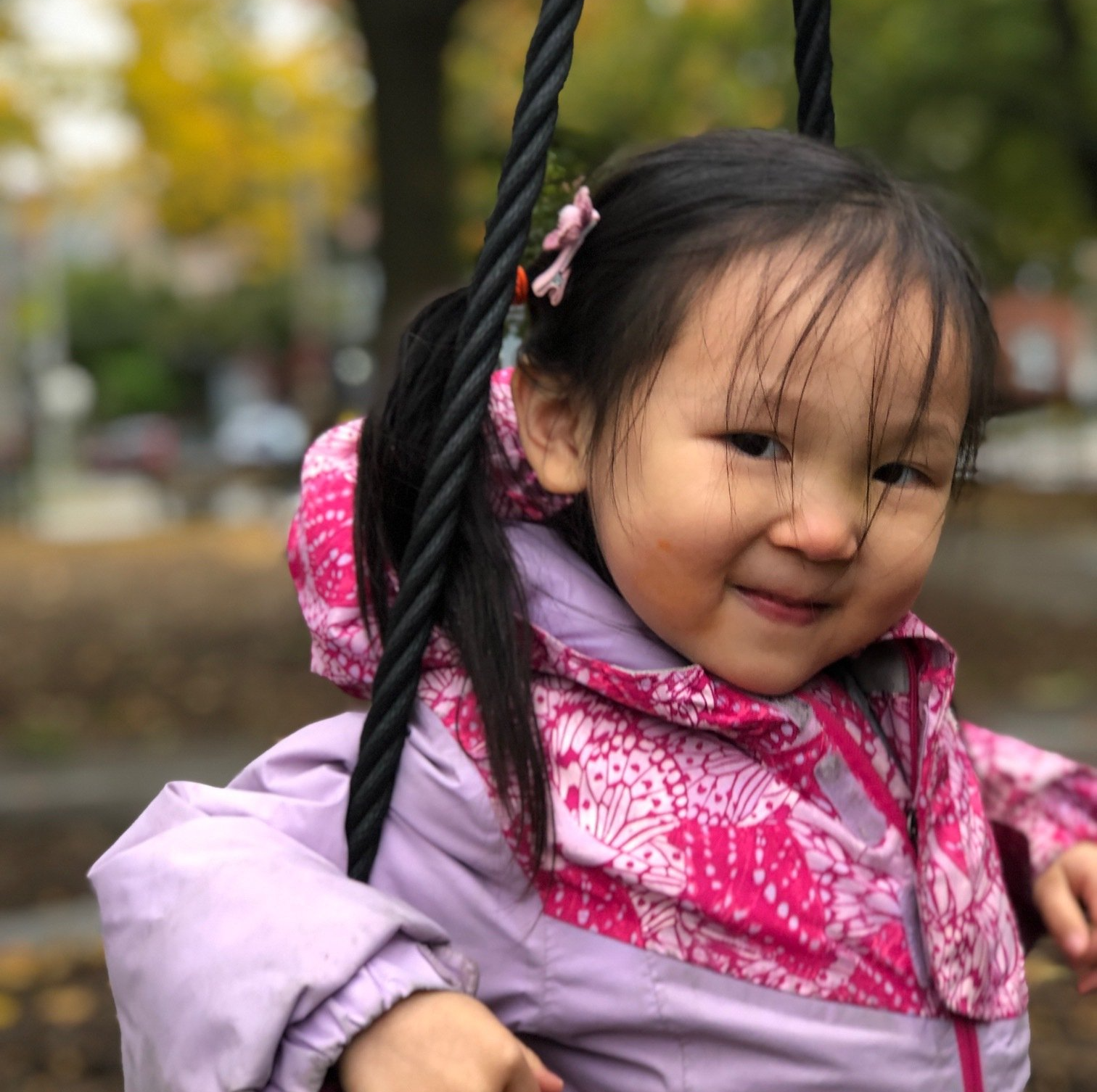 Montessori child smiling at the camera