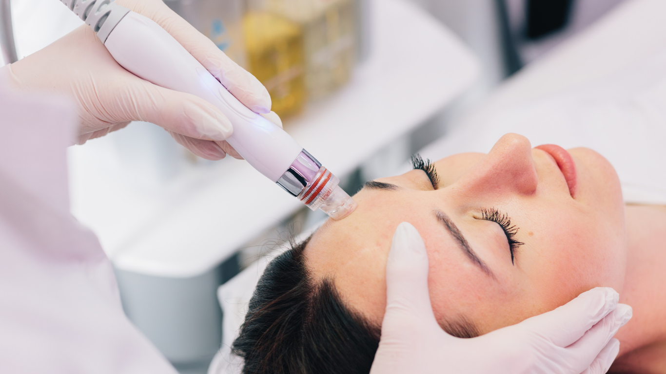 Gloved hands inject facial treatment into a woman’s forehead at a spa clinic