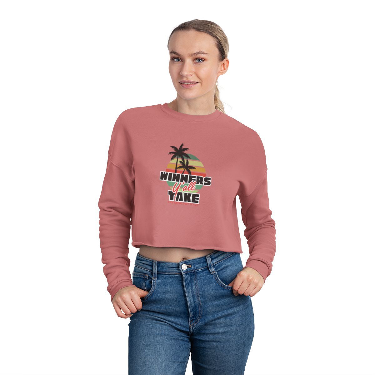 A cropped mauve sweatshirt with a sunset and palm tree graphic that says